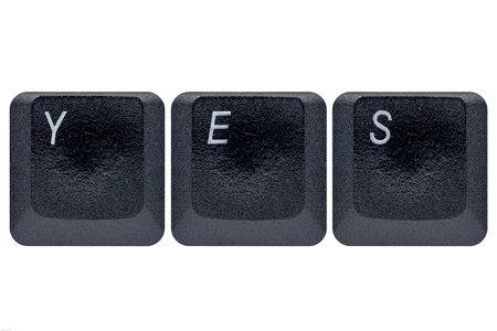 Keyboard keys spelling yes isolated on white background with clipping path.の写真素材