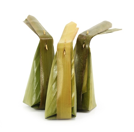 thai style dessert packaging made from banana leaves の写真素材