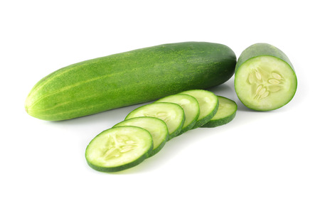 Cucumber and slices isolated over white background の写真素材