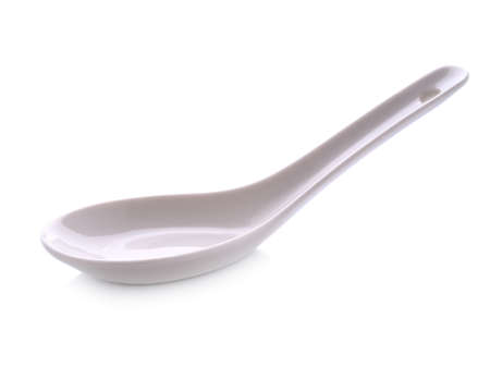 White Chinese soup spoon isolated on white backgroundの写真素材