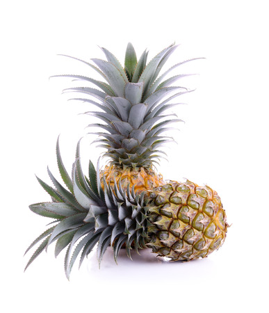 ripe pineapple isolated on whiteの写真素材