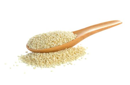 white sesame seeds in wooden spoon on white backgroundの写真素材