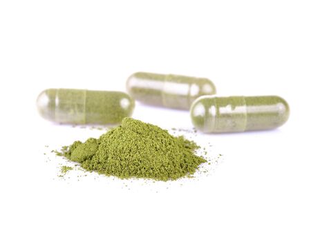Moringa capsule pills on white backgroundの写真素材