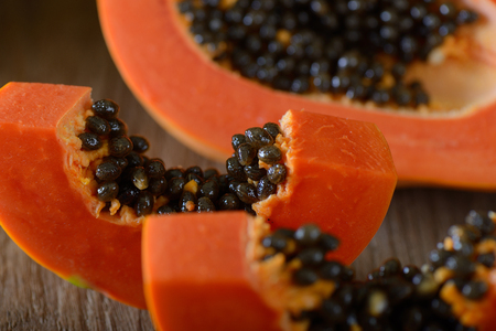 Papaya on wooden tableの写真素材