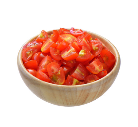 Cherry tomato sliced in wooden bowlの写真素材