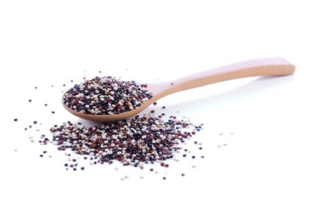 Quinoa in wooden spoon on whiteの写真素材