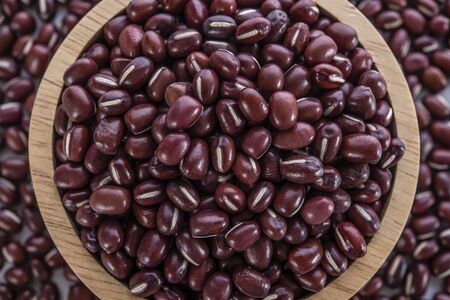 Adzuki beans in wooden bowlの写真素材