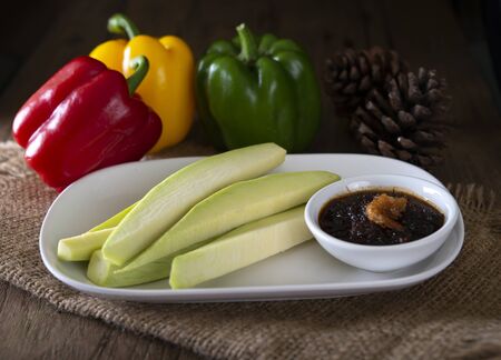 Green Mangoes with Sweet fish sauceの写真素材