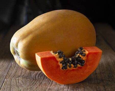 Papaya on wooden background.の写真素材