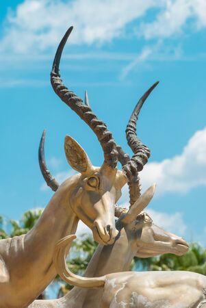 Gold impalas sculpture in front of Gold Reef City Casino in Johannesburgの写真素材