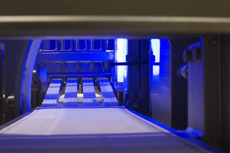 Conveying machine beltline in food industry under blue lightの写真素材