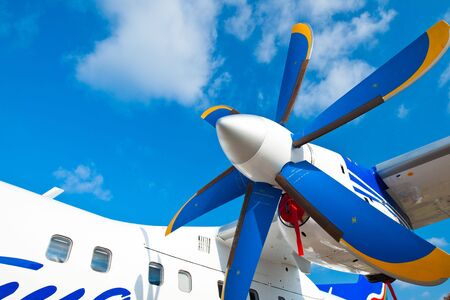 Black wings of an airplane motor in a blue skyの写真素材