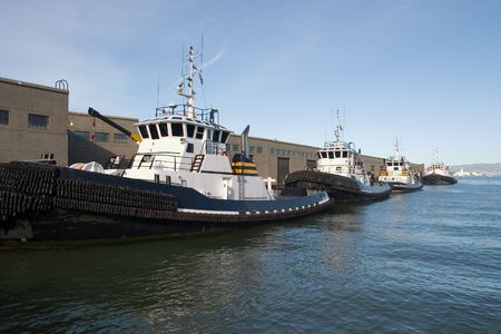 Line of tug boats in San Francisco, Californiaの写真素材