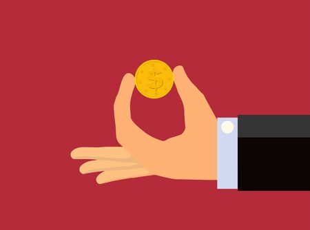 Hand holding between two fingers a gold coin