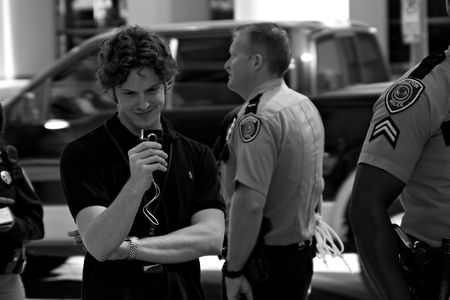 Some smug looking low paid employee of Chevron sent out to make a video of the protest.のeditorial素材