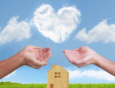 heart cloud two hands homeの写真素材