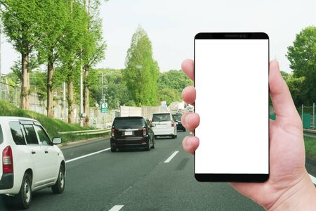 holding smart phone drive background