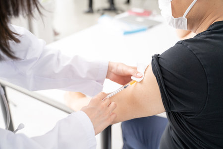 Vaccinating Doctors and Patients - At Handの写真素材