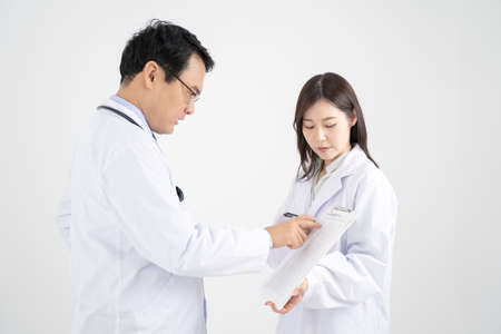 White background image with male and female doctors who have a meeting.の写真素材