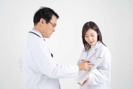 White background image with male and female doctors who have a meeting.の写真素材