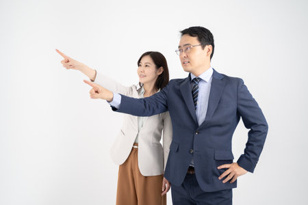 Male and female businessmen with hands in front White backgroundの写真素材