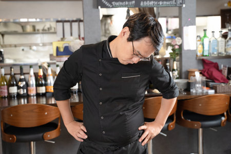 A man who runs a restaurant who is in trouble and depressedの写真素材
