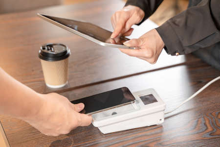 Cashless payment at the takeout of the cafeの写真素材