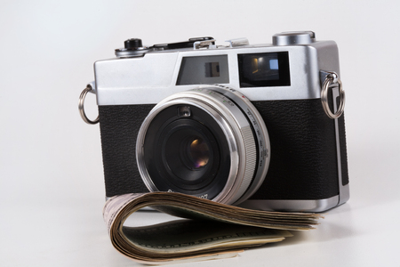 Camera with a dollar, model on dollar banknote, concept and idea of time value and money, realestate...
