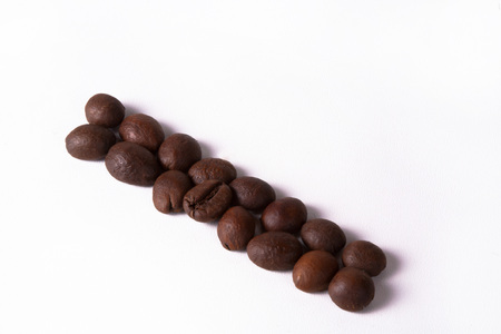 Grain of coffee, beans on a white background. Close-upの写真素材