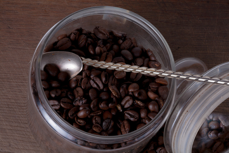 Coffee cup and beans on old kitchen table. Top view with copyspace for your textの写真素材