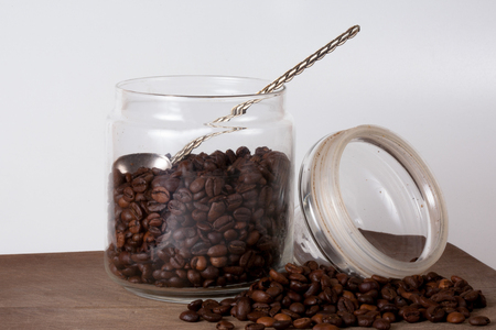 Coffee cup and beans on old kitchen table. Top view with copyspace for your textの写真素材