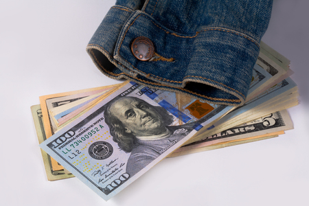 Dollars and denim jackets, symbols of America, business symbols.の写真素材