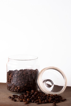 Coffee cup and beans on old kitchen table. Top view with copyspace for your textの写真素材