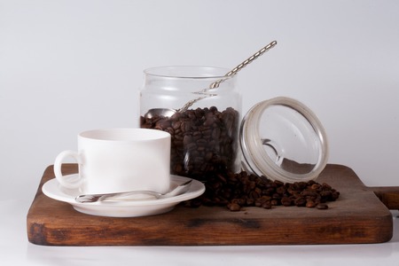 Coffee cup and beans on old kitchen table. Top view with copyspace for your textの写真素材