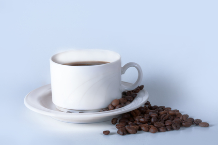 Coffee cup and beans on old kitchen table. Top view with copyspace for your textの写真素材