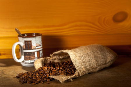 cup of coffee and grinder on sepiaの写真素材