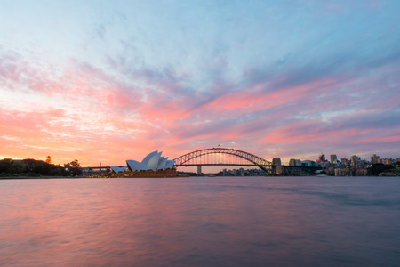 Sydney Opera House and Harbour Bridge at sunset. Sep,11,2016.The Sydney Opera House,Sydney,NSW,Australia.It was designed by Danish architect Jorn Utzon, finally opening in 1973.のeditorial素材