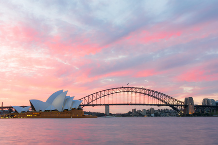 Sydney Opera House and Harbour Bridge at sunset. Sep,11,2016.The Sydney Opera House,Sydney,NSW,Australia.It was designed by Danish architect Jorn Utzon, finally opening in 1973.のeditorial素材