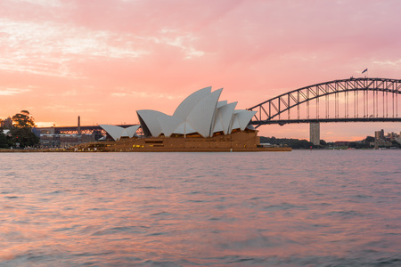 Sydney Opera House and Harbour Bridge at sunset. Sep,11,2016.The Sydney Opera House,Sydney,NSW,Australia.It was designed by Danish architect Jorn Utzon, finally opening in 1973.のeditorial素材
