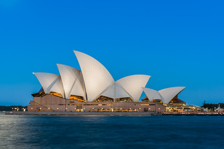 Sydney opera house  view with full moon at sunset in Sydney,Australia.Oct 17,2016 Sydney Opera House is famous arts center. Over 10 millions tourists visit Sydney a year.のeditorial素材