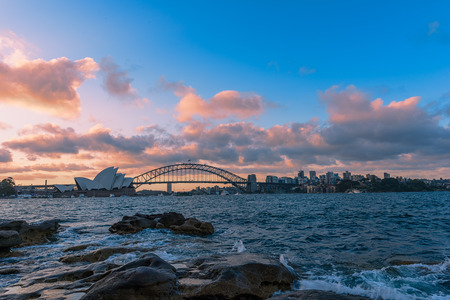 View of  Sydney Opera House And Harbour Bridge at sunset from Mrs macqurie's Chair.NOV 28,2016 The Sydney Opera House is a famous arts center. It was designed by Danish architect Jorn Utzon, finally opening in 1973.のeditorial素材