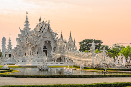 Wat Rong Khun(White temple)at sunset in Chiang Rai,Thailand.02/04/2017 Wat Rong Khun is modern building, well known worldwide.It was  designed by  Chalermchai Kositpipat.Opened it to visitors in 1997.のeditorial素材