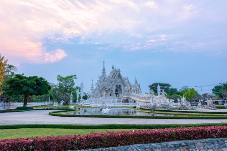 Wat Rong Khun(White temple)at sunset in Chiang Rai,Thailand.02/04/2017 Wat Rong Khun is modern building, well known worldwide.It was  designed by  Chalermchai Kositpipat.Opened it to visitors in 1997.のeditorial素材