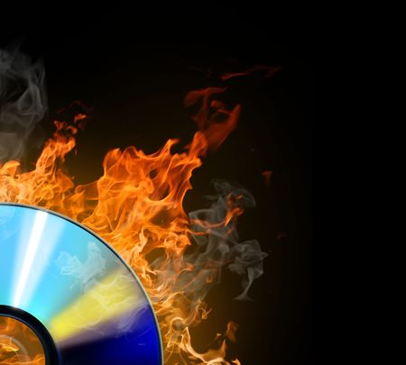burninging disk on colour backgroundの写真素材