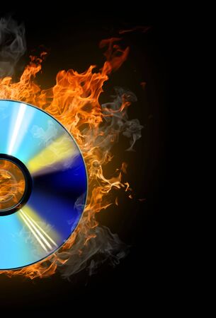 burninging disk on colour backgroundの写真素材