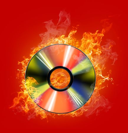 burninging disk on colour backgroundの写真素材