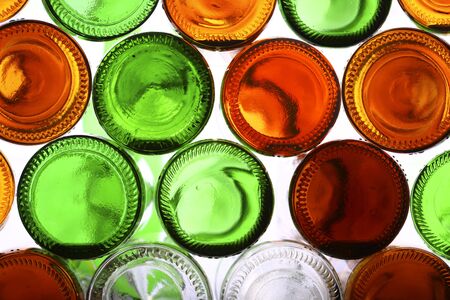 Bottoms of empty glass bottles on whiteの写真素材