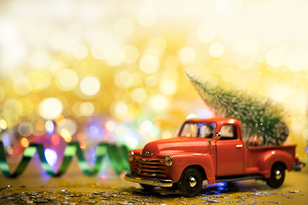 Christmas red truck with a Christmas treeの写真素材