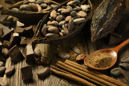 open cocoa fruit lies on a wooden table with cocoa beansの写真素材