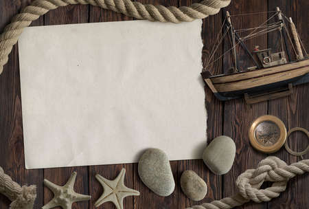 Mockup white paper card with seashells and stones.